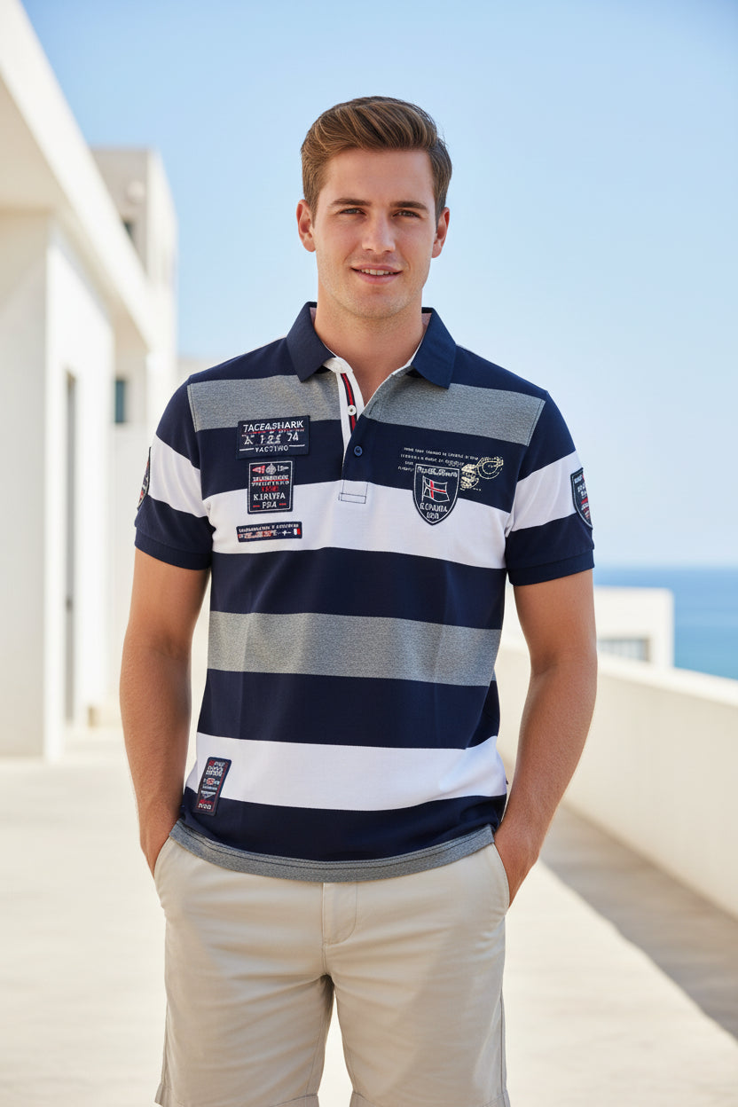 A short-sleeve polo shirt with horizontal navy blue, white, and heather gray stripes, featuring multiple decorative patches and a collar, shown on a plain white background with a TACE&SHARA logo in the top-left corner.