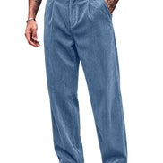 A person wearing light blue corduroy trousers with a black belt, shown from the waist down against a plain white background.