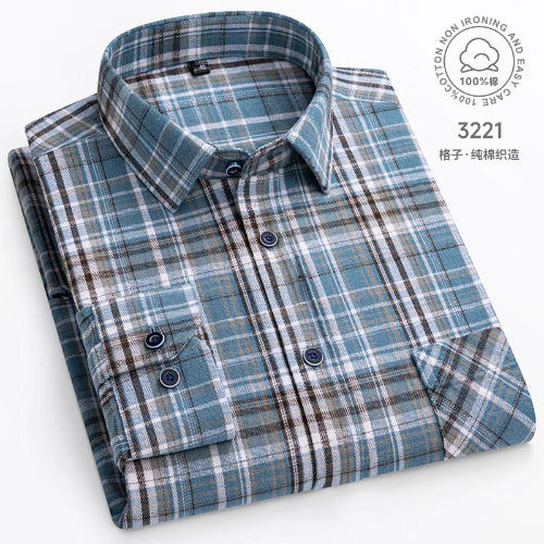 Folded plaid shirt with a label on a white background