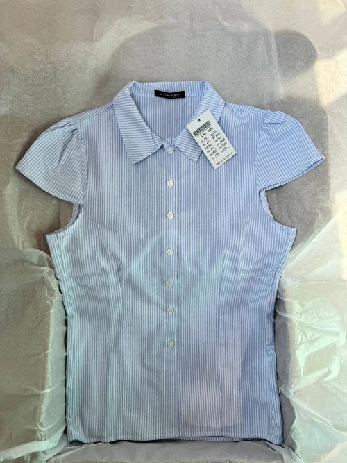 Blue and white striped shirt with a tag on a light gray background