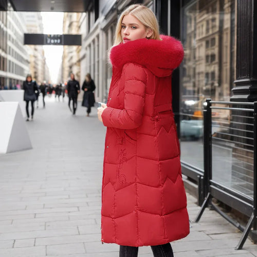 Woman wearing a red puffer coat on a city street