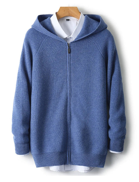 Blue hoodie with a white shirt underneath on a wooden hanger against a white background