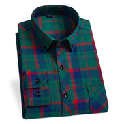 Folded green and red plaid shirt on a white background