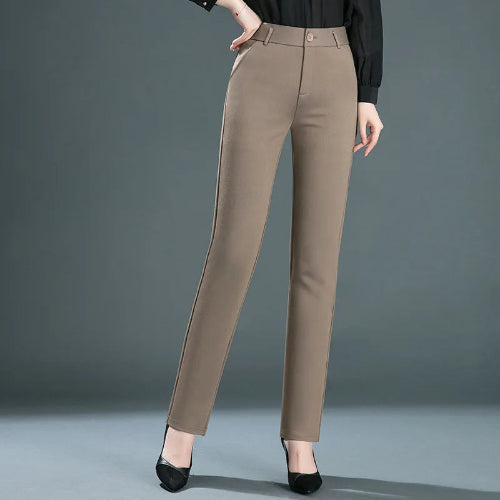 Brown pants worn by a person on a gray background