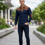 Navy sweater with brown collar and arm patches on a white background