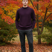 Purple sweater on a hanger with a hand touching it, featuring a 'warm' icon.