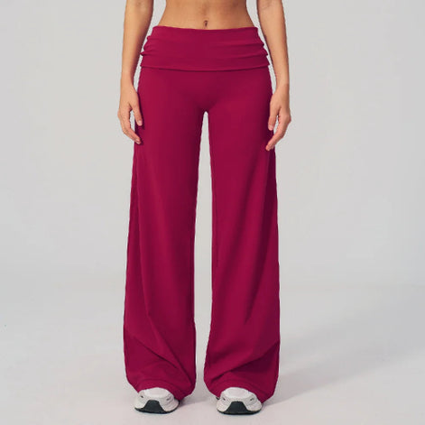 Person wearing magenta wide-leg pants on a plain background