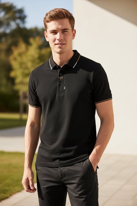 Close-up of a black polo shirt with a brand logo on a gray background
