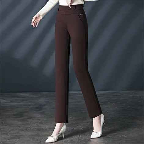 Brown pants worn by a person on a dark background