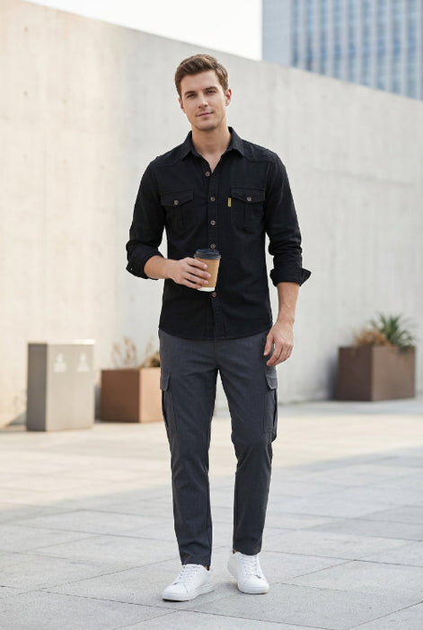Black button-up shirt with two front pockets on a white background