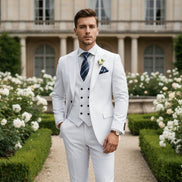 White suit with a striped tie and boutonniere on a white background