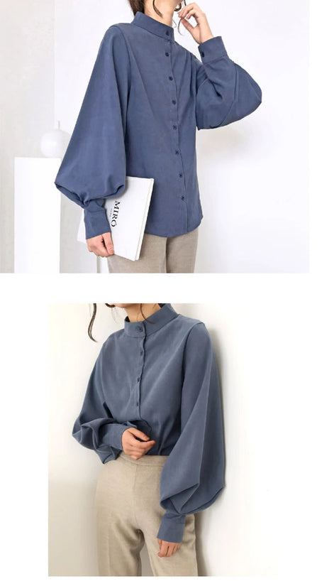 Blue blouse worn by a person on a white background