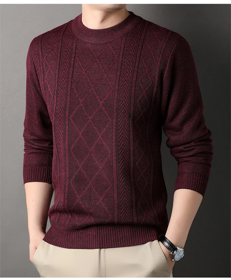 Maroon patterned sweater worn by a person on a gray background