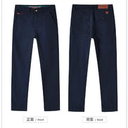 Front and back views of dark navy blue slim-fit chino pants on a white background, showing the front pocket area and back pocket details.