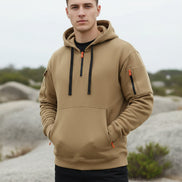 Beige hoodie with black and orange accents on a white background