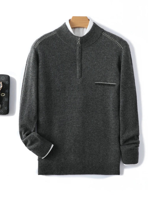 Dark gray quarter-zip mock-neck sweater with a chest pocket, displayed against a white background with a wooden hanger visible behind the collar.