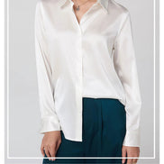 White silk shirt worn by a model, framed with text about the 95% mulberry silk and 5% spandex fabric.