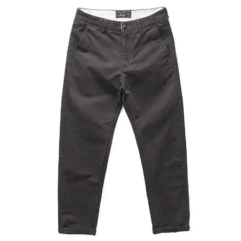A pair of dark charcoal gray slim-fit pants shown flat against a solid white background.