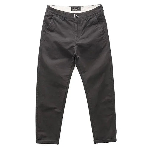 A pair of dark charcoal gray slim-fit pants shown flat against a solid white background.