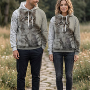 A light gray pullover hoodie featuring a large, realistic 3D-printed graphic of a fluffy gray tabby kitten on the front, with white drawstrings and a white hood lining.