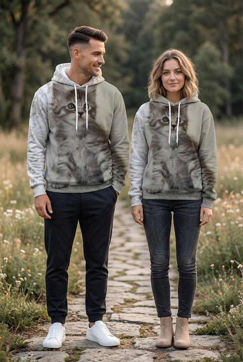 A light gray pullover hoodie featuring a large, realistic 3D-printed graphic of a fluffy gray tabby kitten on the front, with white drawstrings and a white hood lining.