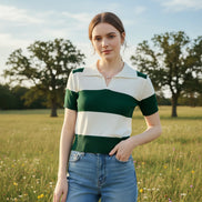 A woman wearing a short-sleeve knit polo shirt with horizontal green and off-white stripes, seated on a brown leather chair.