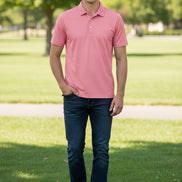 Pink polo shirt on a white background