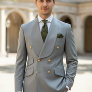 Gray suit with gold buttons on a mannequin and separate pants on a white background