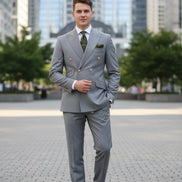 Gray suit with gold buttons on a mannequin and separate pants on a white background