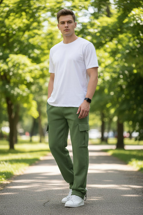 Person wearing green cargo pants on a white background