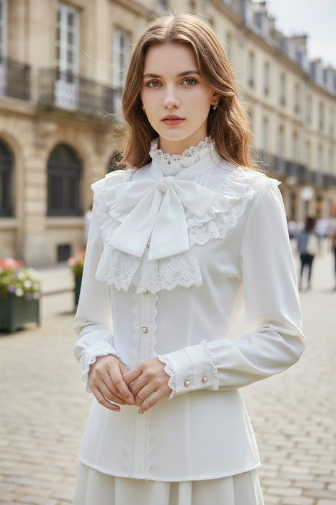 White blouse with lace details on a white background