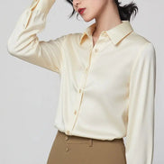 Cream silk shirt worn by a model, shown from the front.