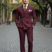 Maroon suit with a brown tie and white shirt on a white background