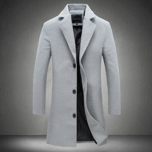 Gray coat with a brand label on a gray background