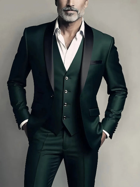 Man wearing a dark green suit with a white shirt against a neutral background