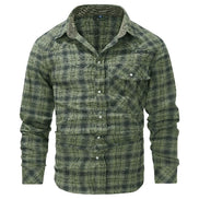 A men's long-sleeve plaid button-up shirt in green and black, featuring a chest pocket and button-down front, shown on a plain white background.