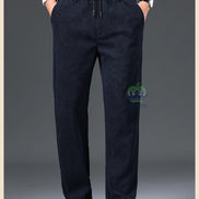 Navy blue pants worn by a person on a gray background