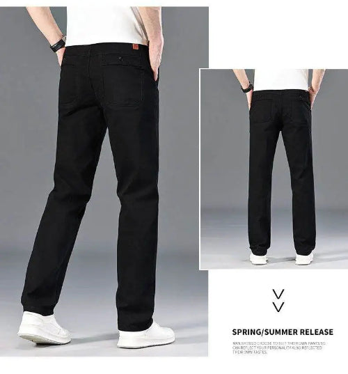 Black straight-leg jeans shown on a model from the back, with a main large view and a smaller inset view. The model is wearing a white t-shirt and white sneakers 