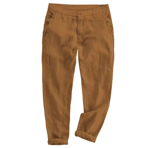 A pair of men's slim-fit trousers in a warm camel brown color, shown flat against a solid white background.
