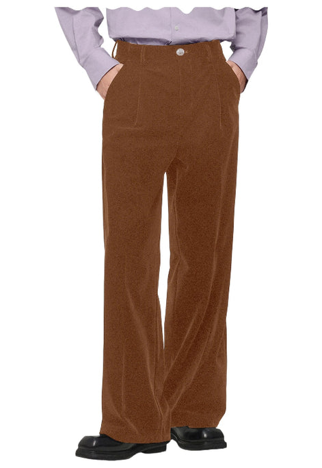 A person wearing high-waisted, wide-leg brown corduroy trousers, paired with a light lavender ruffled blouse and black shoes, 