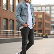 White sneakers with red and blue accents on a stone surface