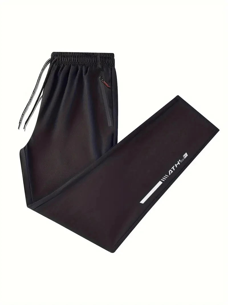 Black drawstring pants with a logo on a white background