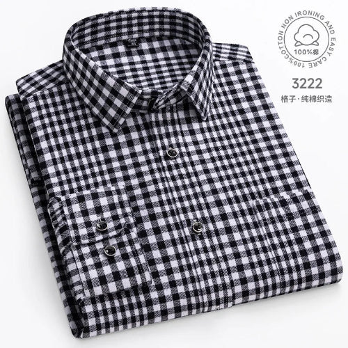 Folded black and white checkered shirt with care label on a white background