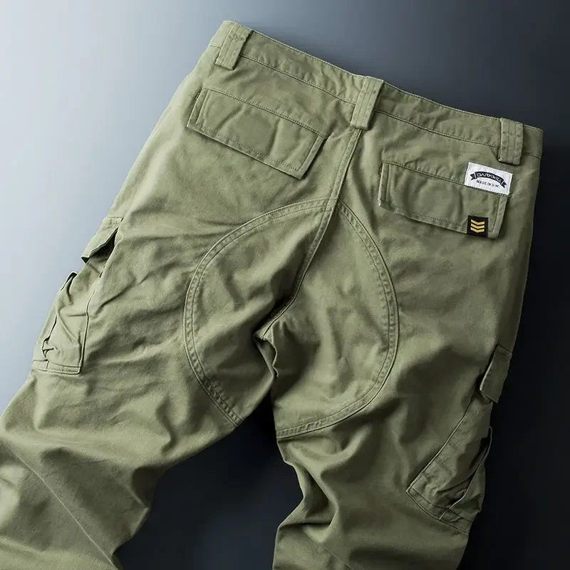 Army green cargo pants shown flat from the back. 