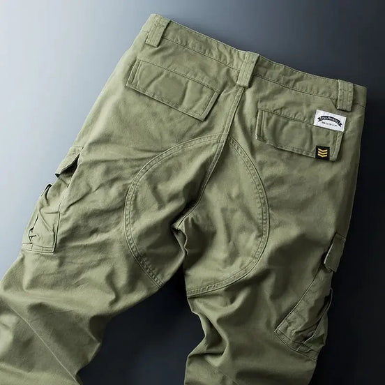 Army green cargo pants shown flat from the back. 