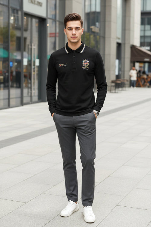 Black polo shirt with embroidery and a watch on a dark background