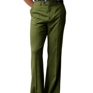 Green pants worn by a person on a white background