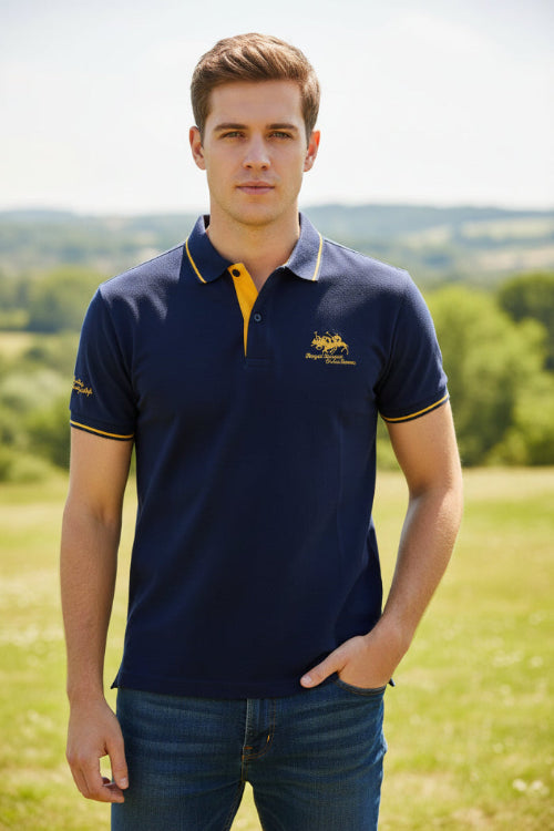 Navy blue polo shirt with yellow accents and brand logo on a gray background