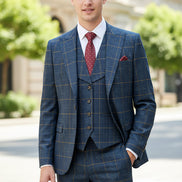 Blue checkered suit on a mannequin against a brown curtain background