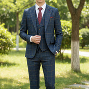 Blue checkered suit on a mannequin against a brown curtain background